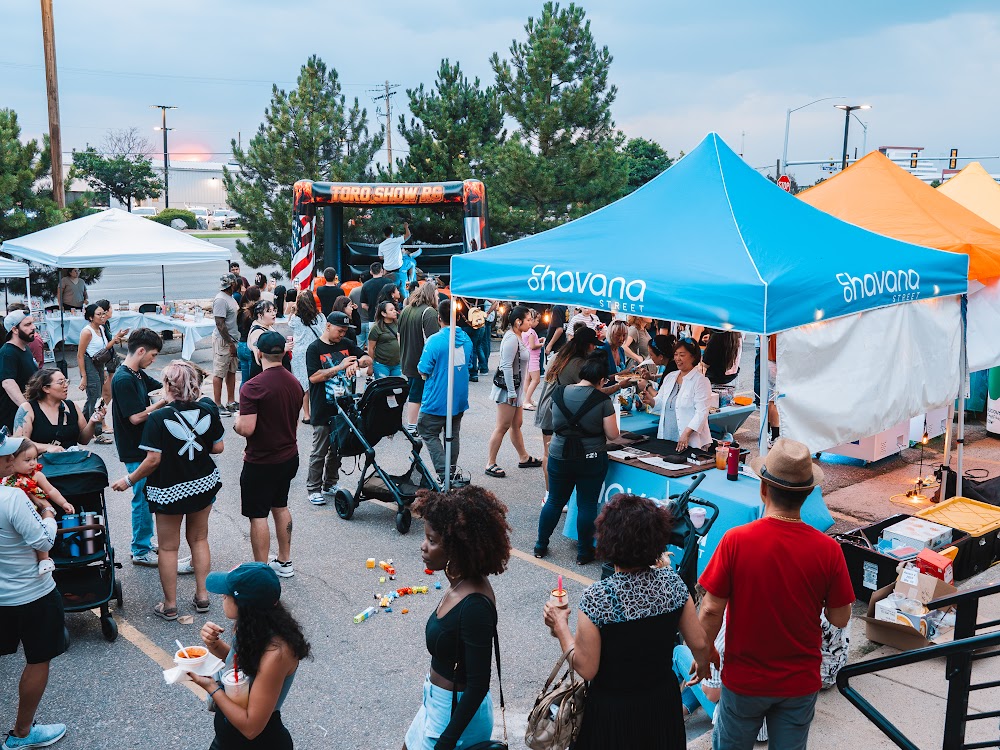 Crowd browsing vendor tents at Havana Street Night Market in Aurora, Colorado