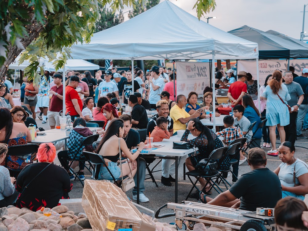 Guests seated at a night market dinner