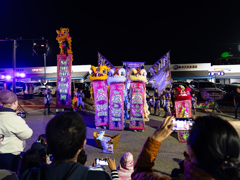 Illuminated dancers performing at Lunar New Year on Havana Street, Aurora