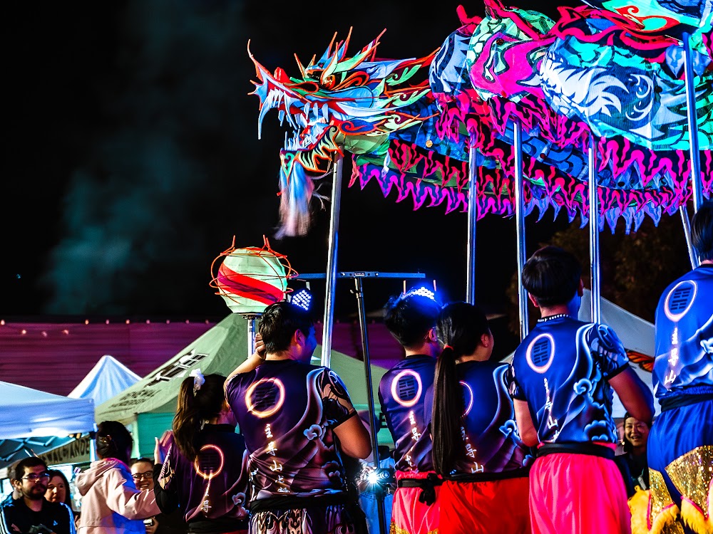 Illuminated dragon puppet parade at night